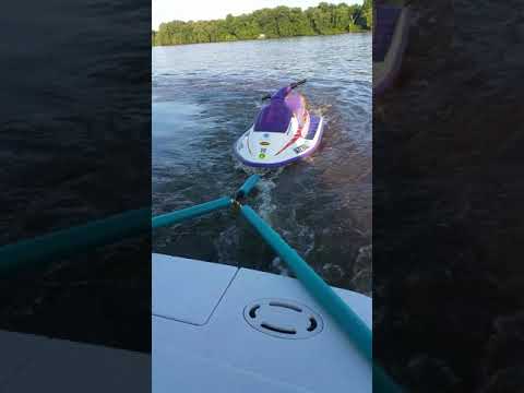 Boat towing a jetski